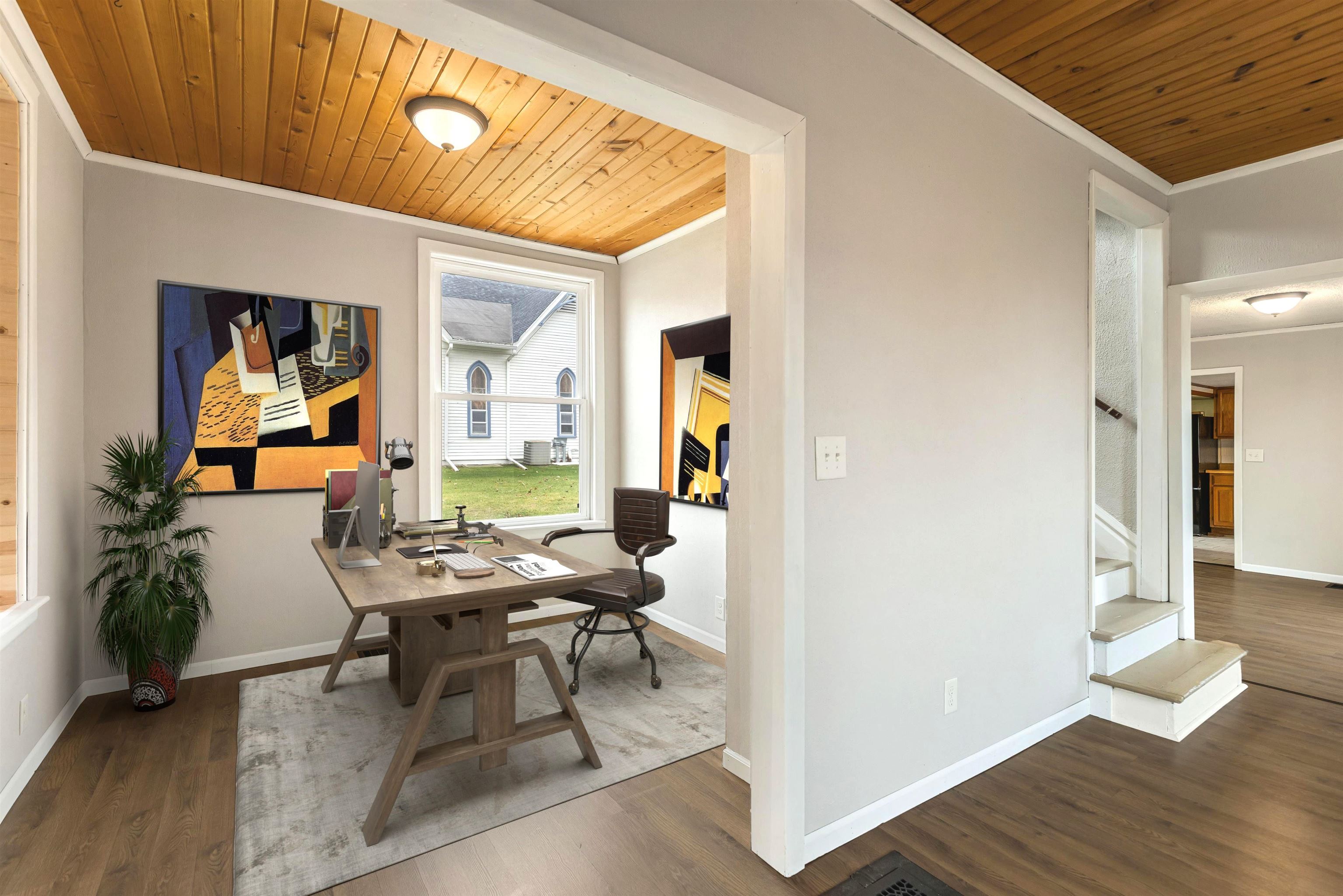 209 South Elida Street Winnebago, IL 61088 - Photo 8 of 48 a workspace with furniture and wooden floor