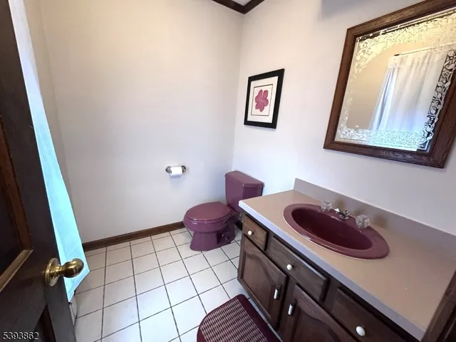 a view of a room with a flat screen tv and a floor to ceiling window