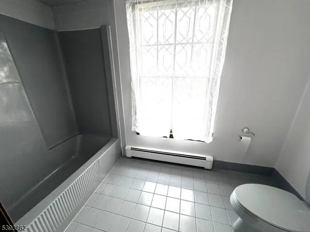 a bathroom with a double vanity sink and mirror