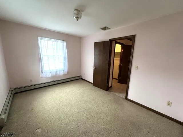 a view of a house with a yard and garage