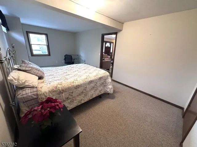 a kitchen that has a lot of cabinets a sink and wooden floor