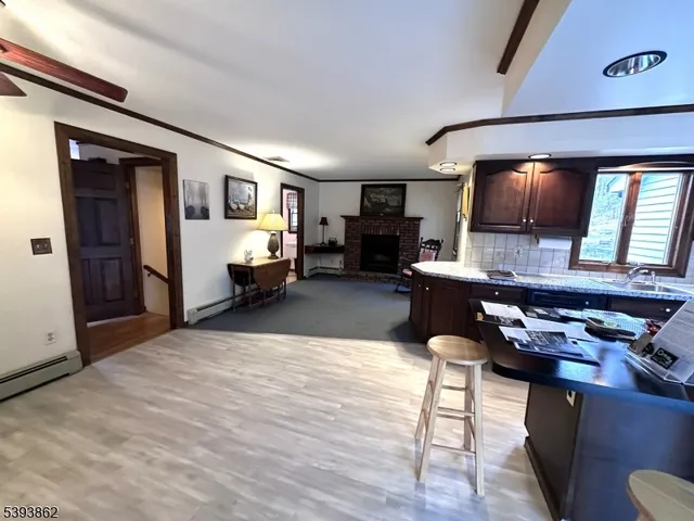 a living room with furniture or couch and a wooden floor