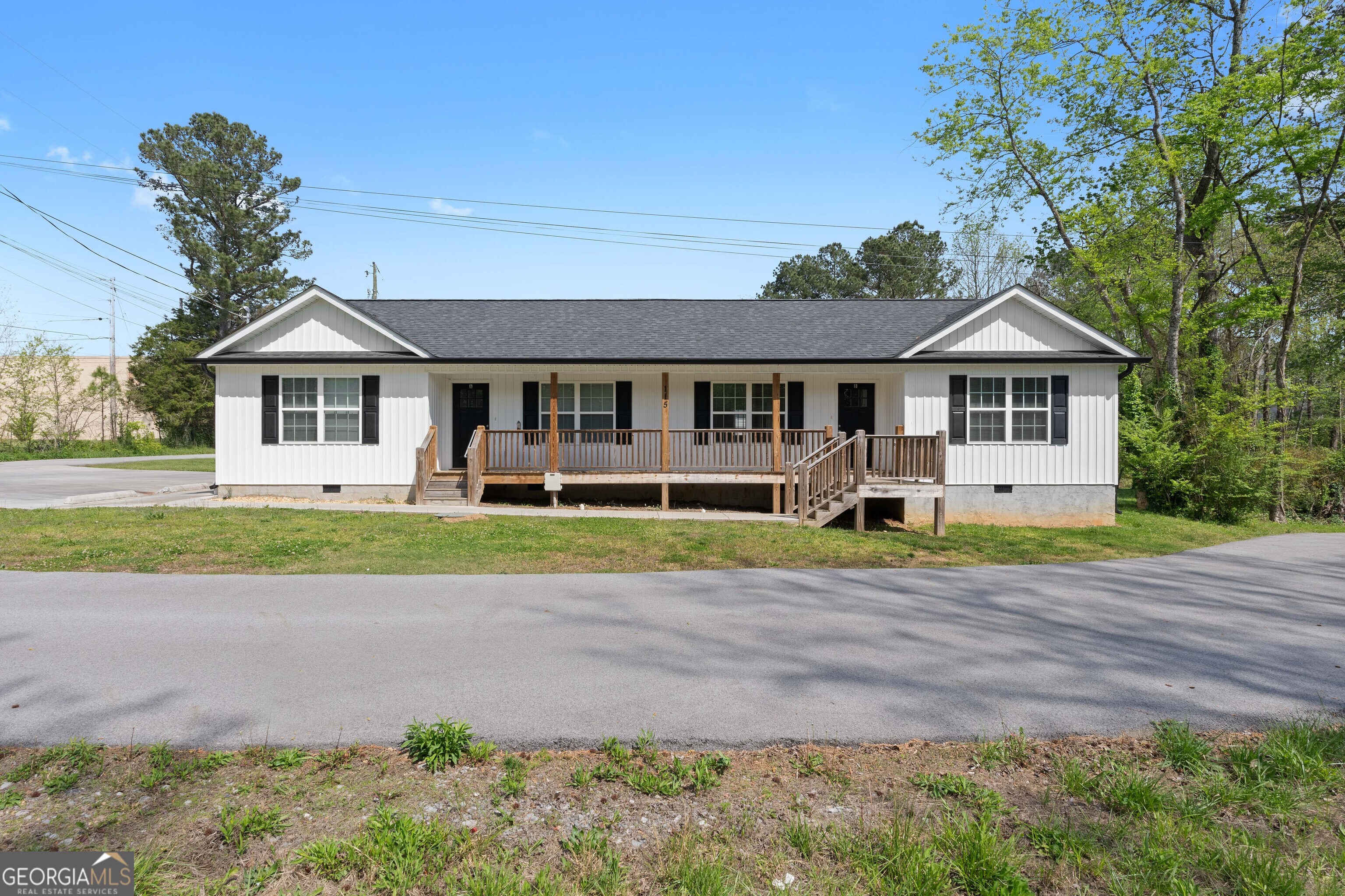 front view of a house with a yard