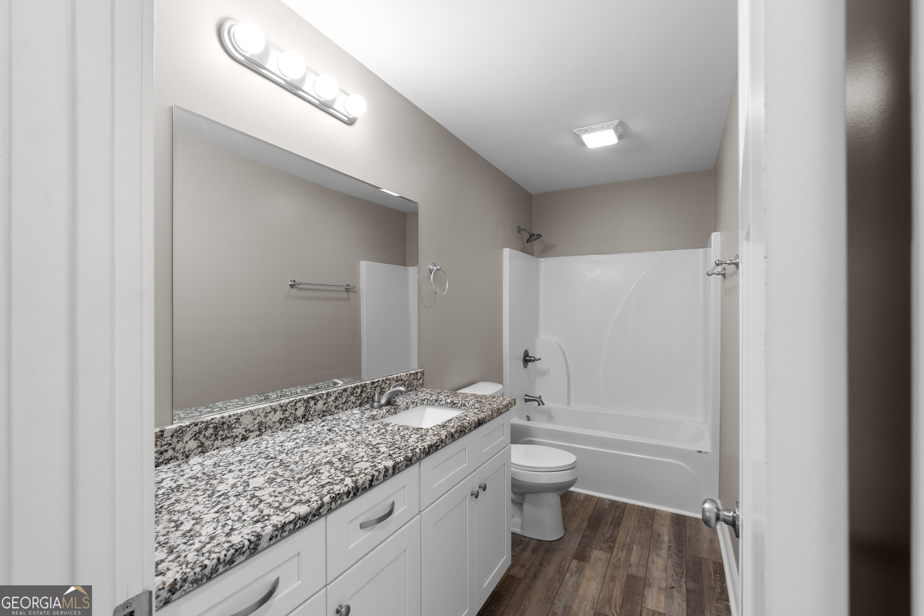 115 Buster Lane Rocky Face, GA 30740 - Photo 15 of 28 a bathroom with a granite countertop sink a toilet and shower