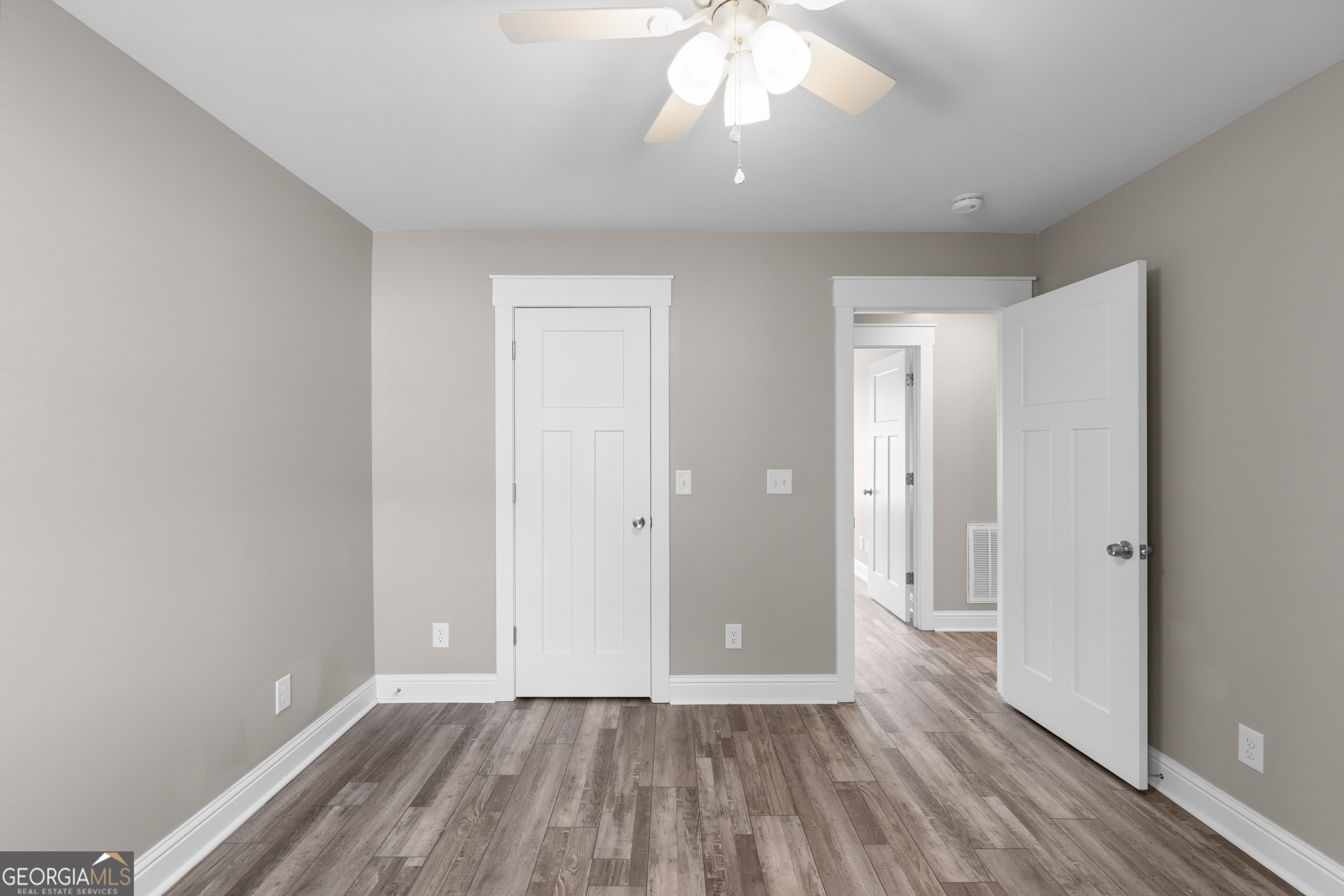 115 Buster Lane Rocky Face, GA 30740 - Photo 18 of 28 a view of an empty room with wooden floor and a window