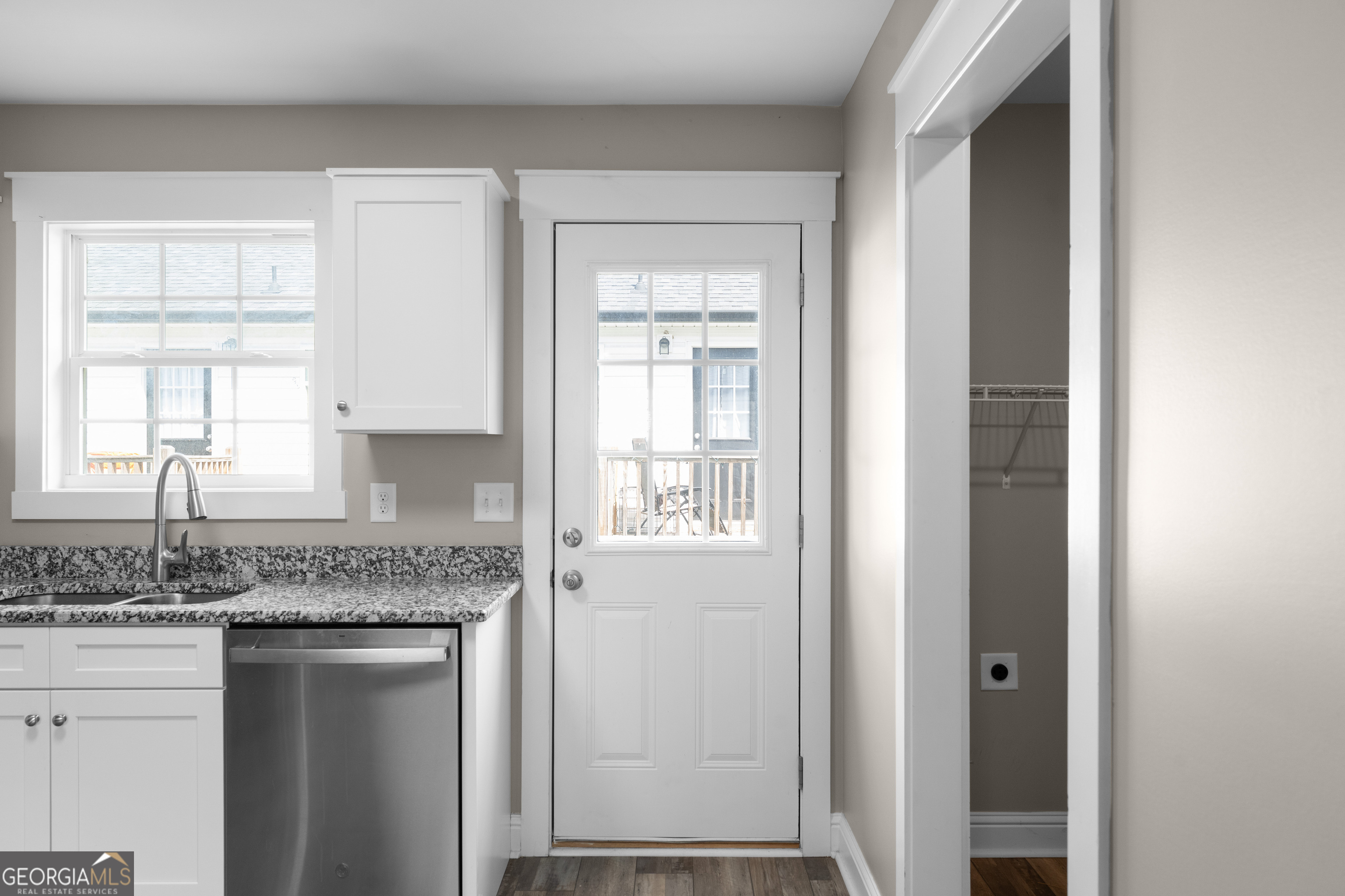 115 Buster Lane Rocky Face, GA 30740 - Photo 25 of 28 a kitchen with granite countertop cabinets appliances and a window