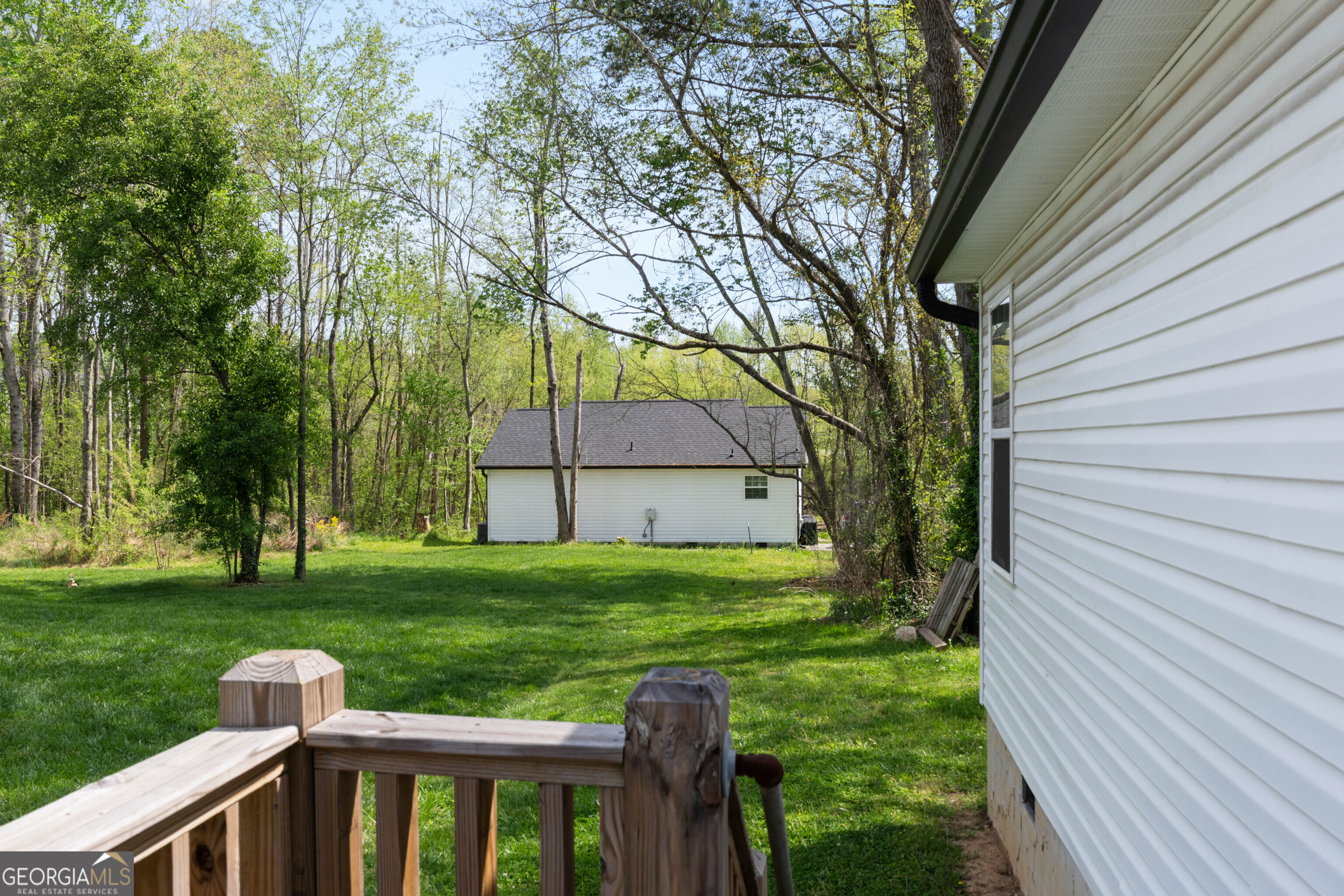 115 Buster Lane Rocky Face, GA 30740 - Photo 28 of 28 a view of a house with backyard and a tree
