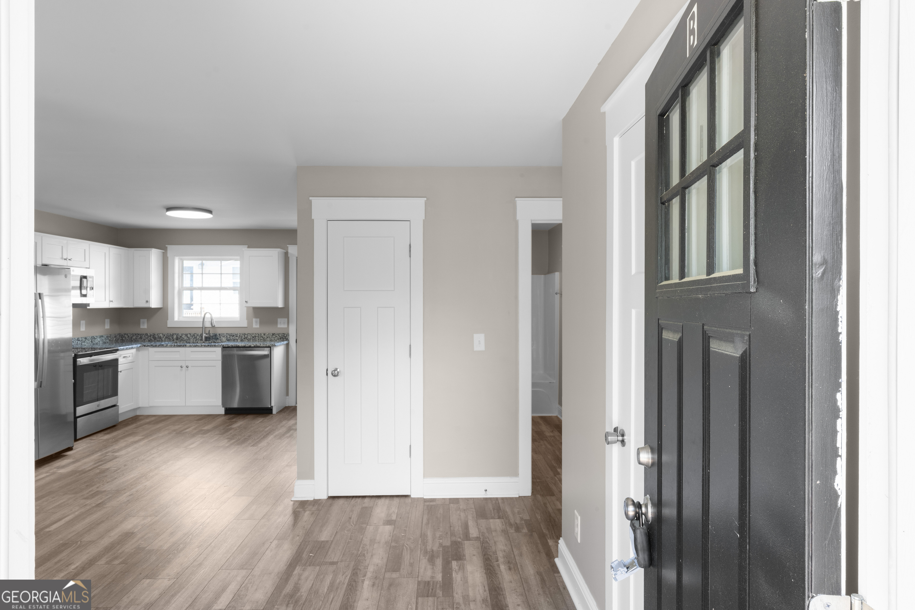 115 Buster Lane Rocky Face, GA 30740 - Photo 5 of 28 a view of kitchen with wooden floor and electronic appliances