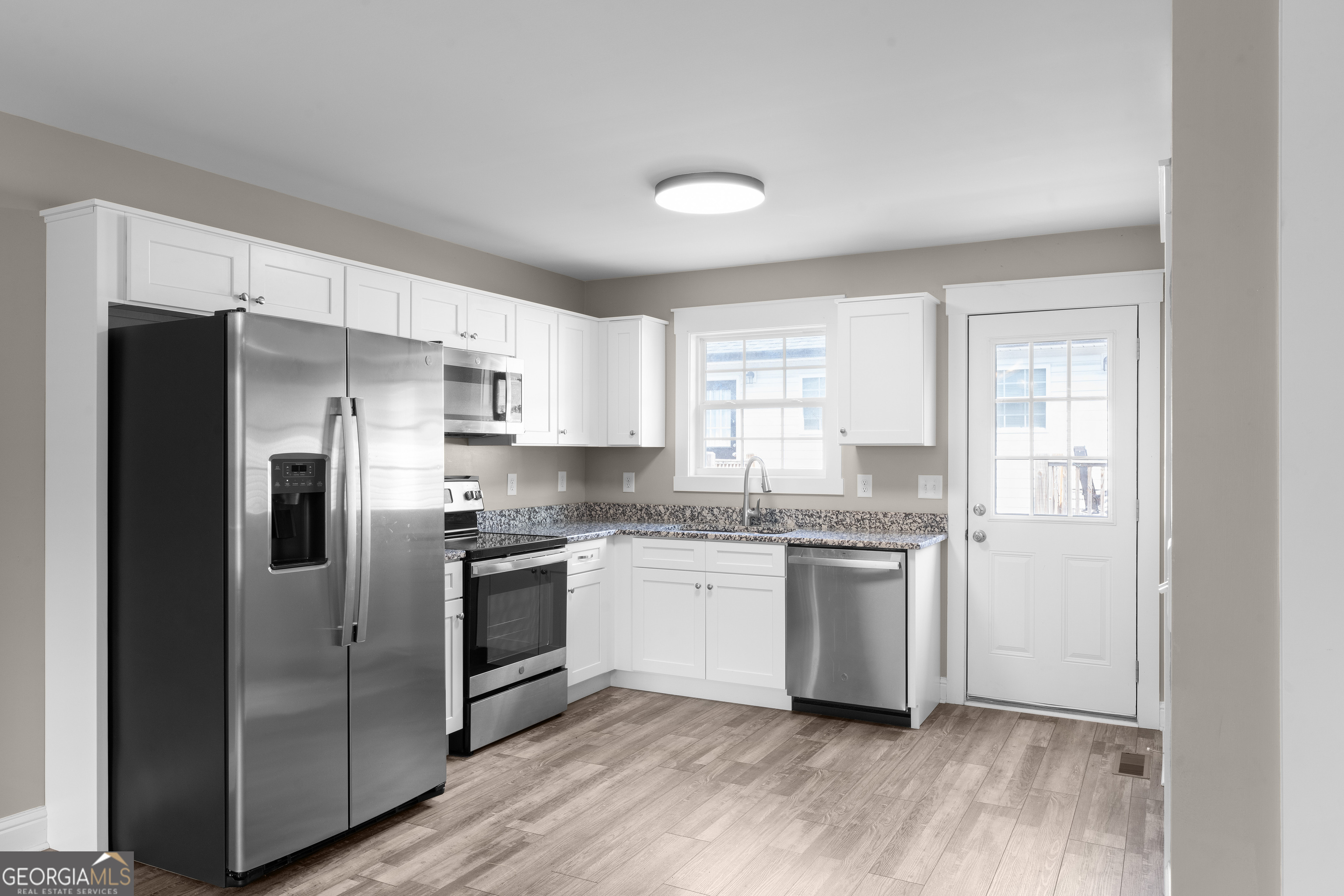 115 Buster Lane Rocky Face, GA 30740 - Photo 10 of 28 a kitchen with stainless steel appliances a refrigerator sink and microwave