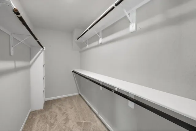 a bathroom with a bathtub and a window