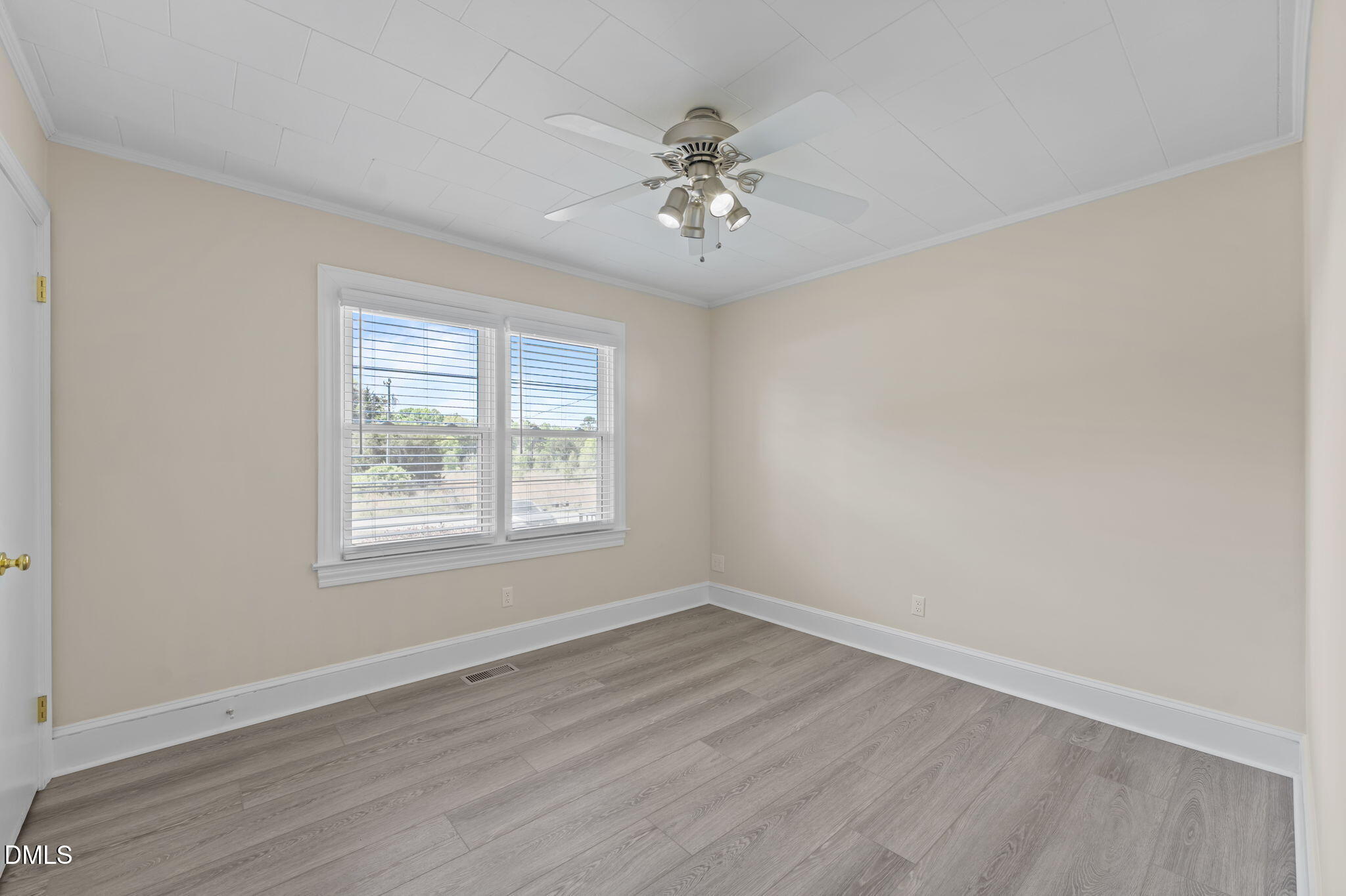 1723 Power Line Road Elon, NC 27244 - Photo 14 of 22 an empty room with wooden floor and windows