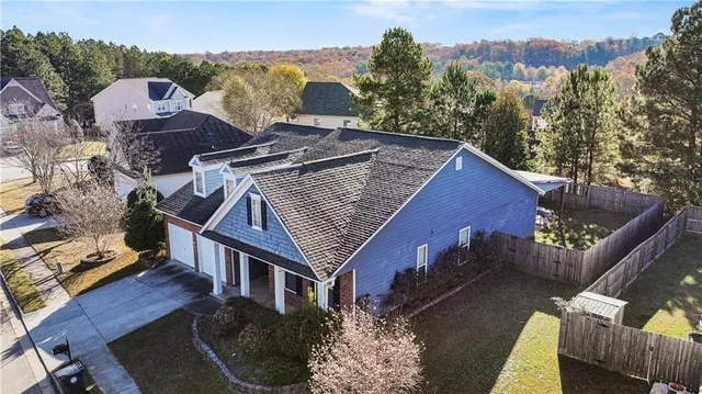 an aerial view of houses with deck