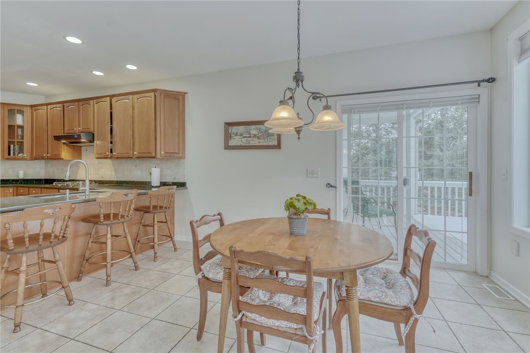 67 Angels Path Penfield, NY 14580 - Photo 20 of 47 KITCHEN DINETTE * SLIDER TO BACKYARD DECK