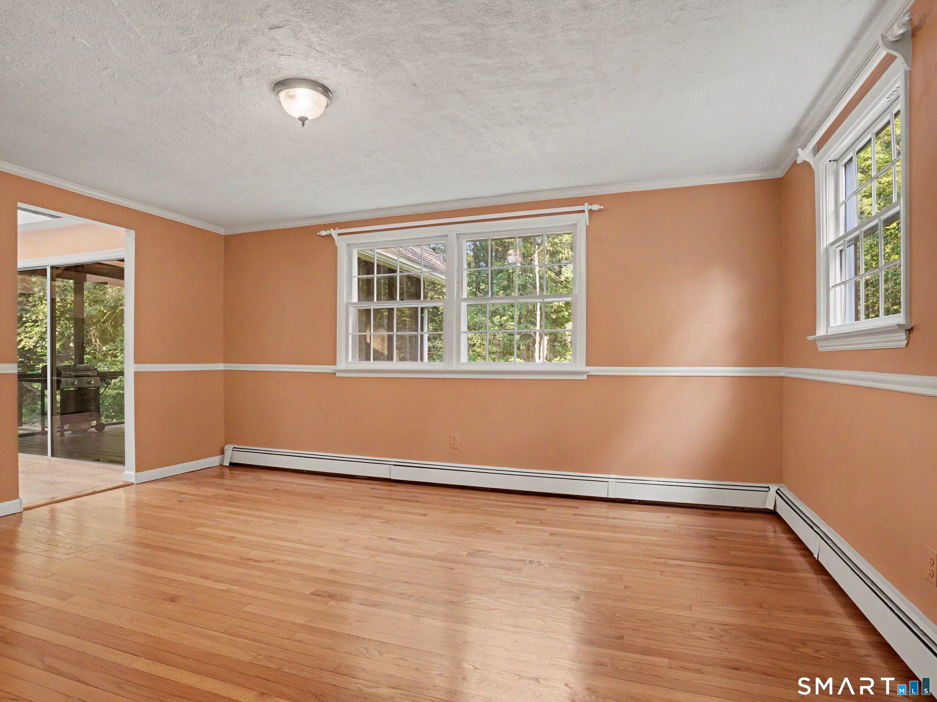 15 Flat Rock Drive Ridgefield, CT 06877 - Photo 12 of 39 an empty room with wooden floor and windows