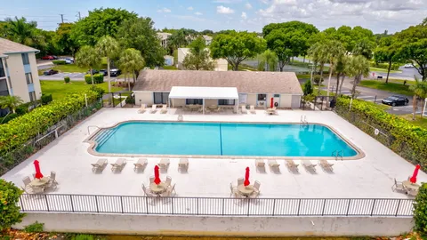 an aerial view of a house with a swimming pool