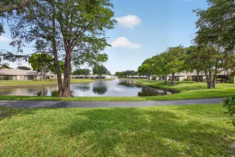 a view of a lake with houses by side of it
