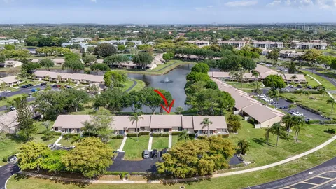 an aerial view of residential house with outdoor space and swimming pool