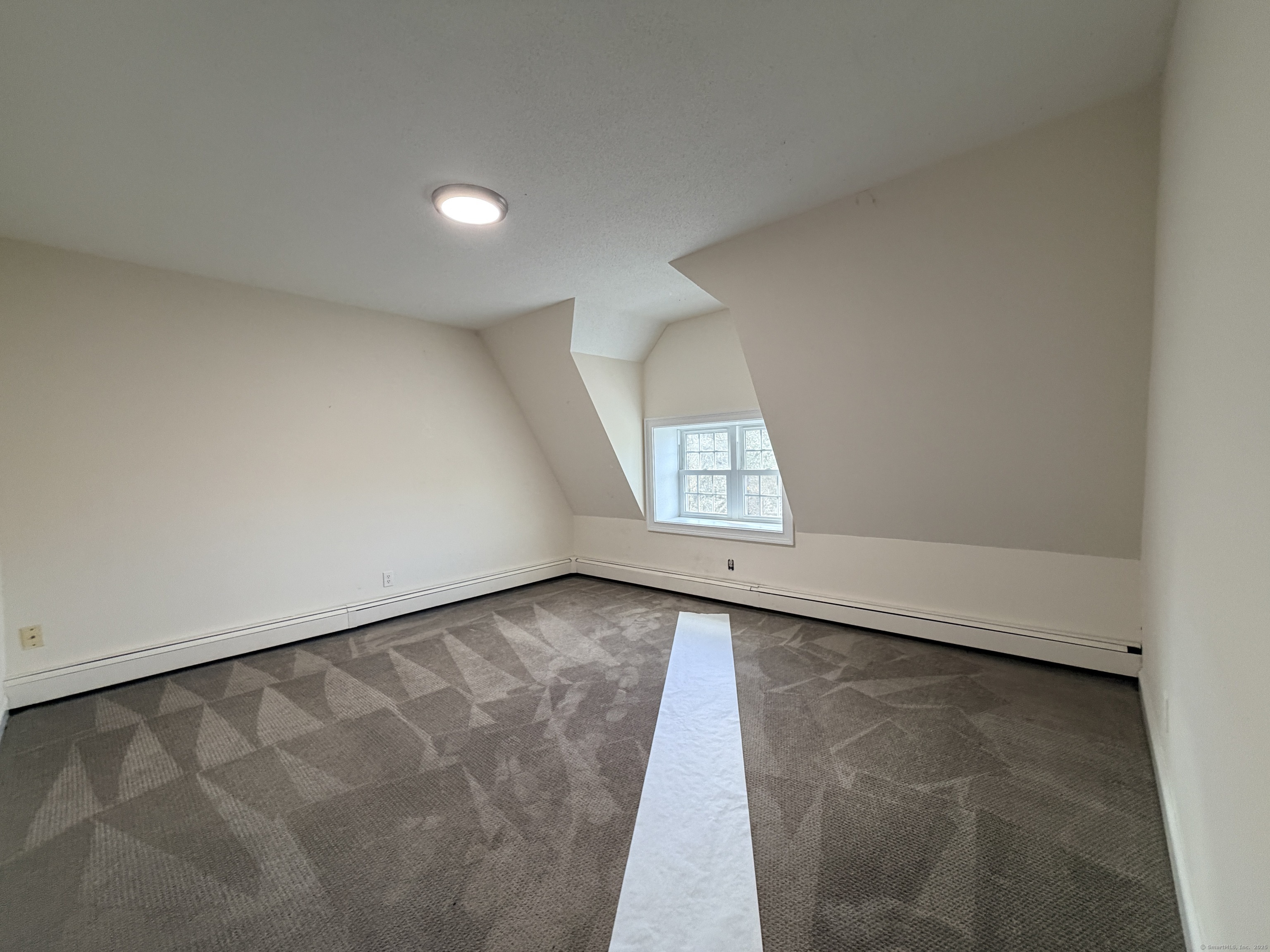 765 Orange Street, Unit 1 New Haven, CT 06511 - Photo 6 of 11 an empty room with windows