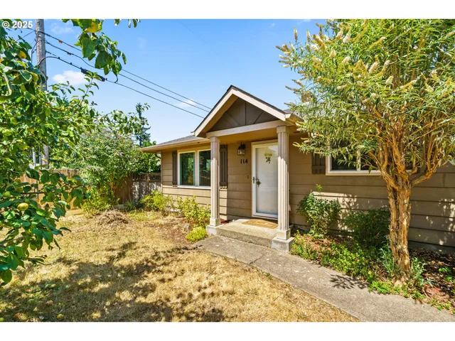 a front view of a house with a yard
