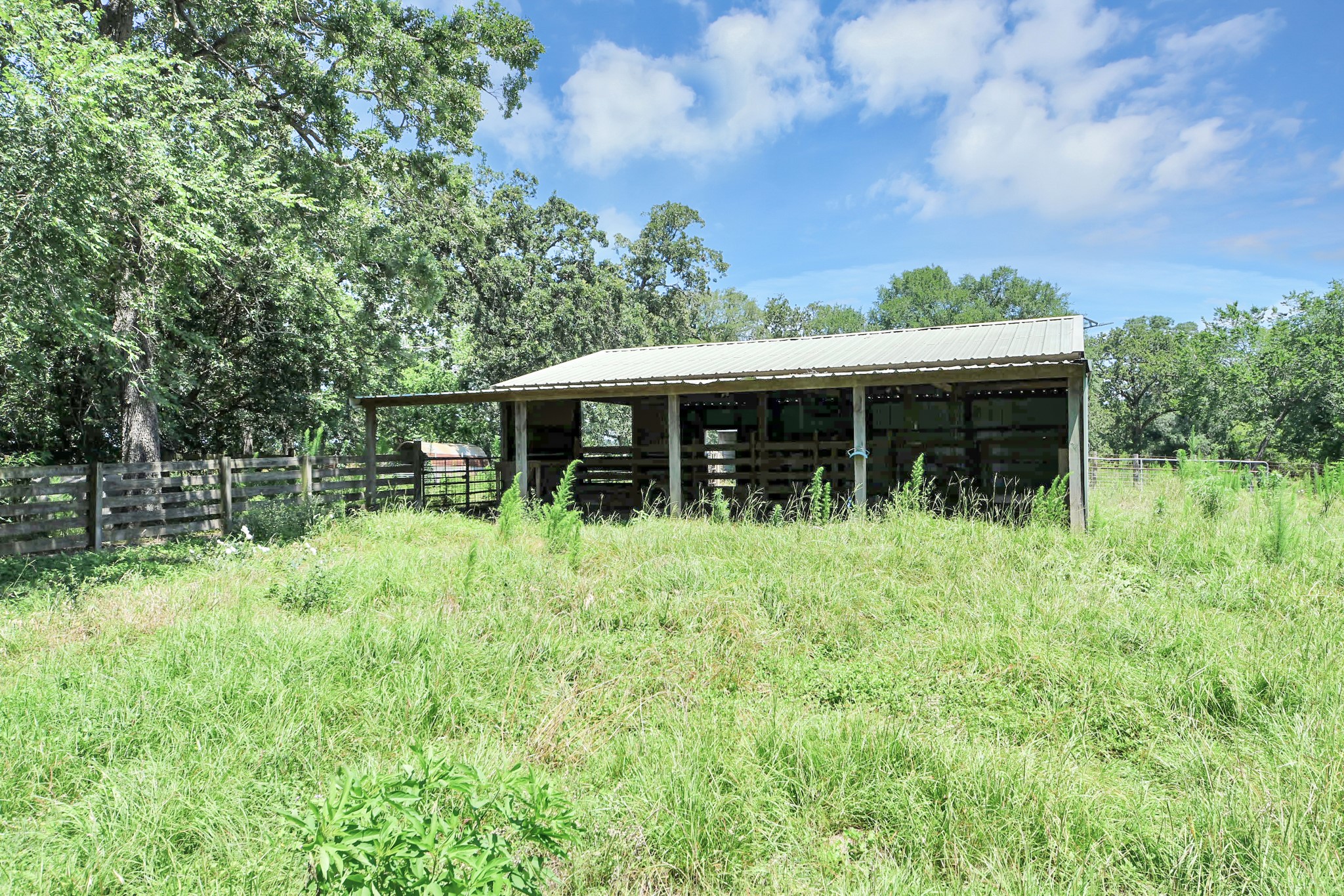 28222 Margerstadt Road Waller, TX 77484 - Photo 45 of 50 Multiple barns support livestock, equipment storage, and agricultural use.
