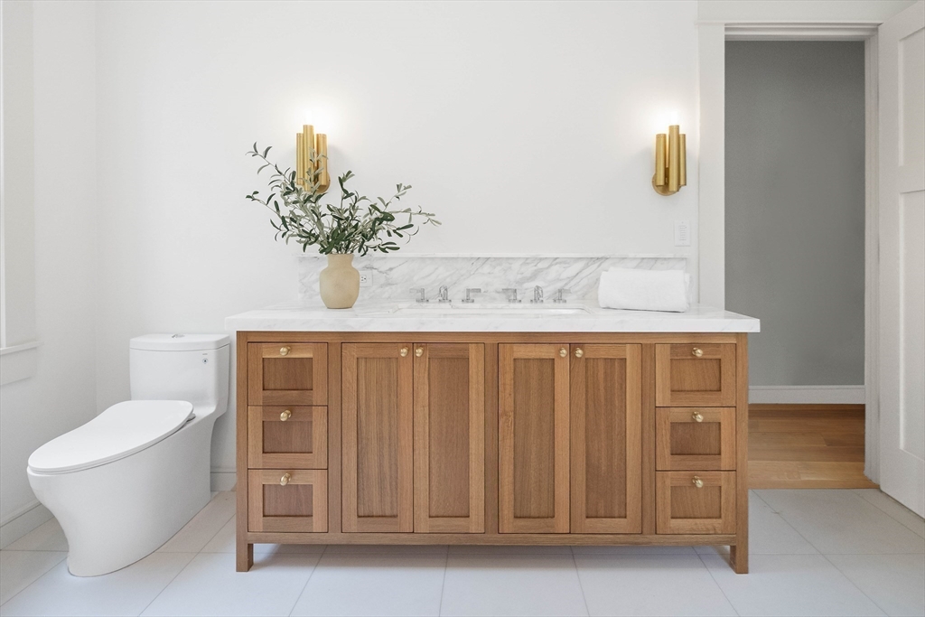 3 Home Meadows Lane Hingham, MA 02043 - Photo 11 of 19 a bathroom with a granite countertop sink and a mirror