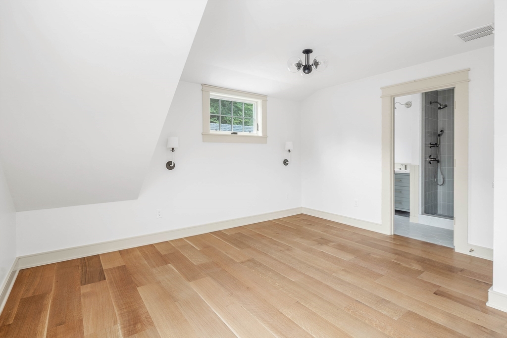 3 Home Meadows Lane Hingham, MA 02043 - Photo 15 of 19 a view of an empty room with wooden floor and a window