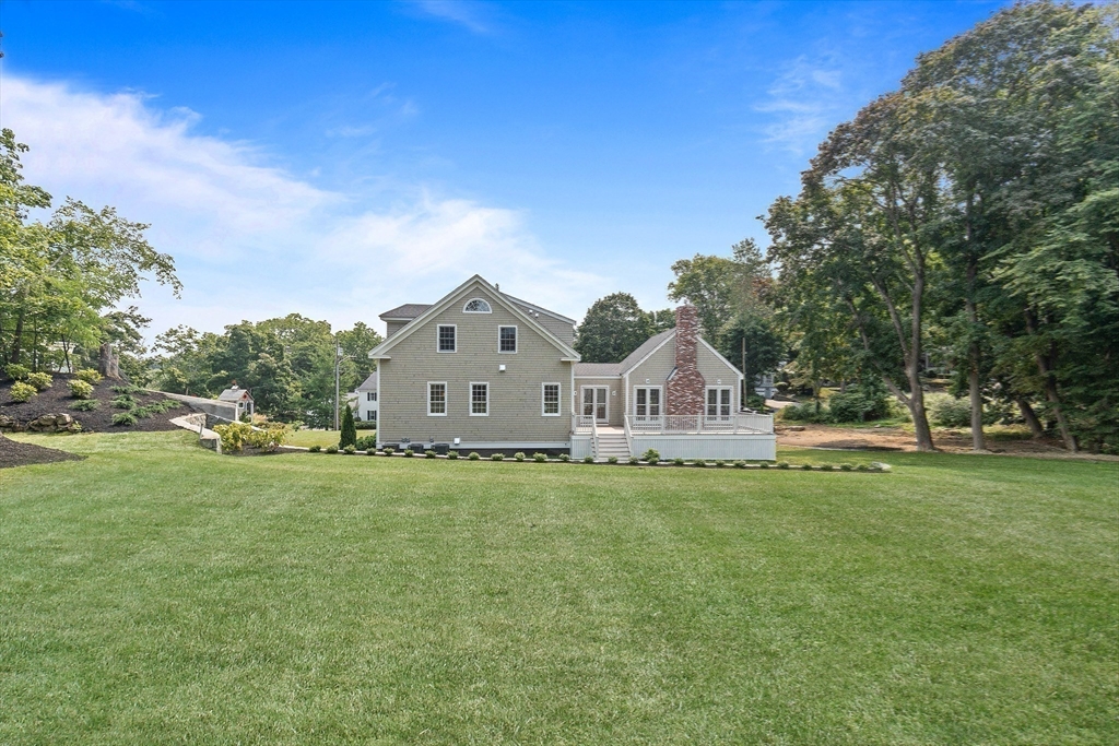 3 Home Meadows Lane Hingham, MA 02043 - Photo 18 of 19 a large house with a big yard and large trees