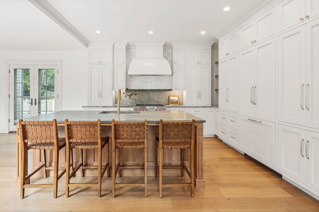 3 Home Meadows Lane Hingham, MA 02043 - Photo 2 of 19 a kitchen with granite countertop white cabinets and chairs