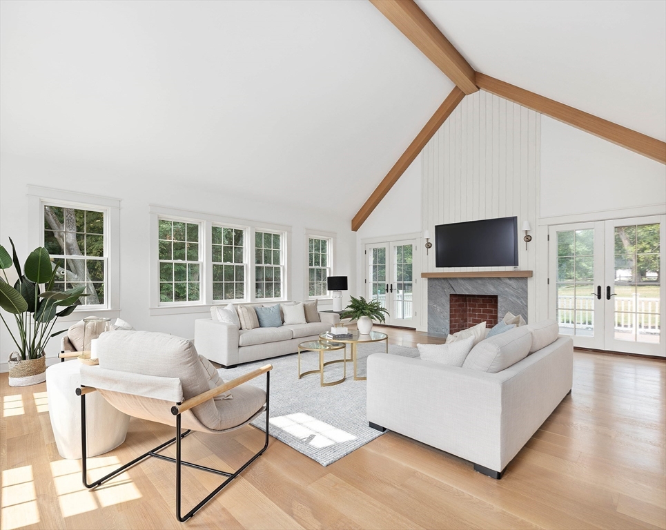 3 Home Meadows Lane Hingham, MA 02043 - Photo 5 of 19 a living room with furniture a fireplace and a large window