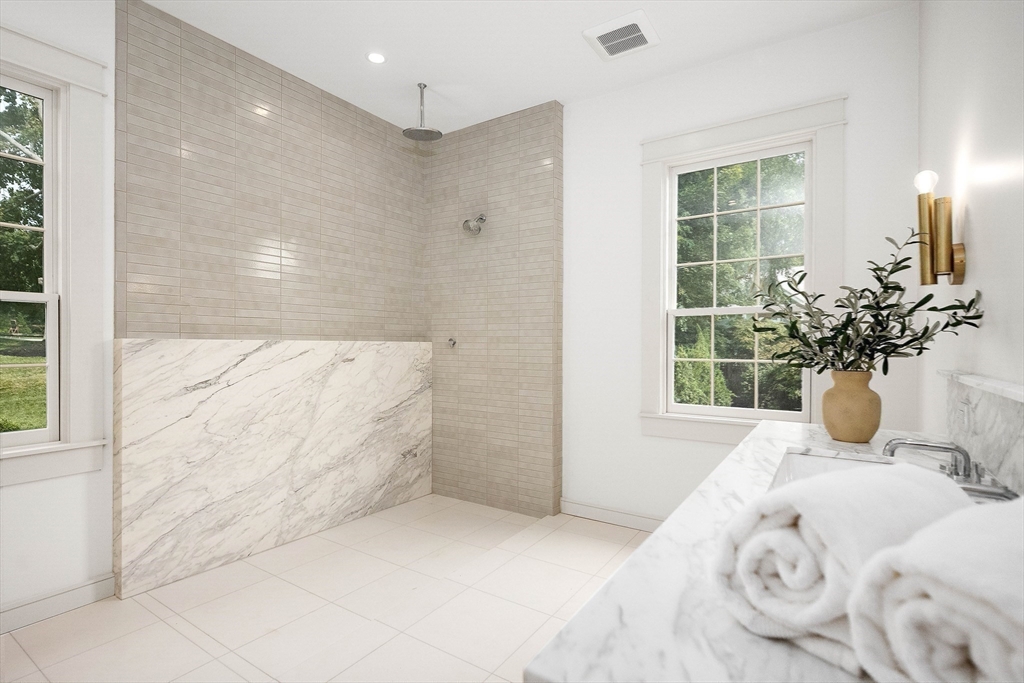 3 Home Meadows Lane Hingham, MA 02043 - Photo 10 of 19 a bathroom with a tub shower and window