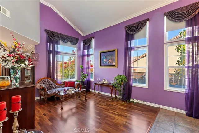 a kitchen with stainless steel appliances granite countertop a stove refrigerator and wooden floor
