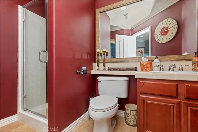 a bathroom with a sink vanity and mirror