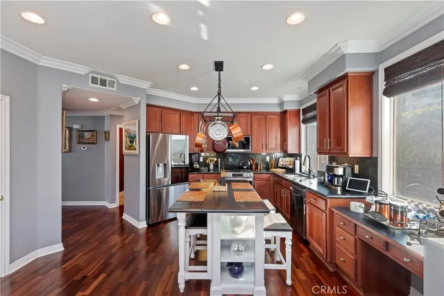 a bed room with a bed mirror and a chandelier