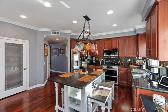 a spacious bedroom with furniture and a window
