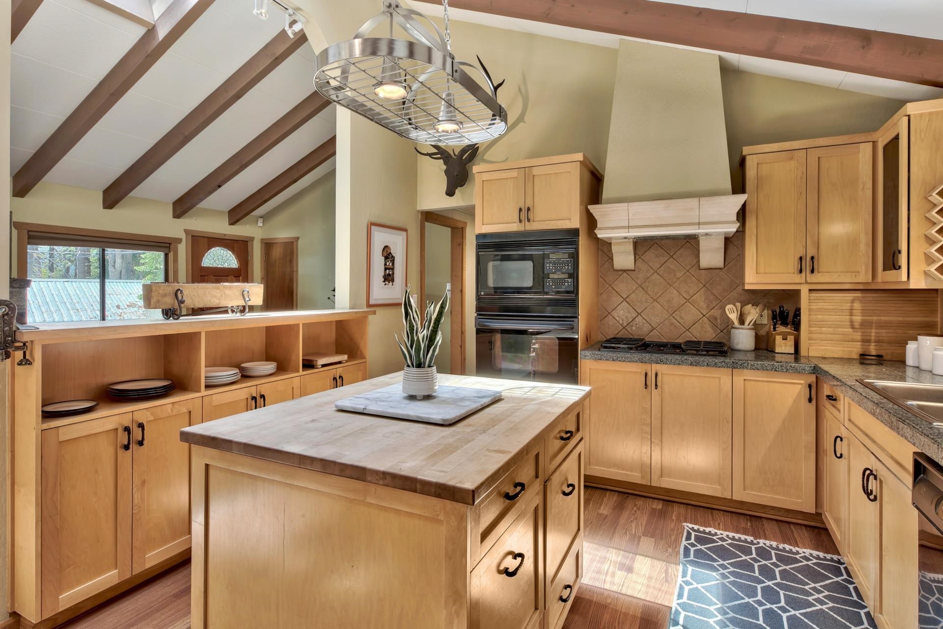 10101 Gregory Place Truckee, CA 96161 - Photo 11 of 21 a open kitchen with stainless steel appliances granite countertop a sink stove and refrigerator