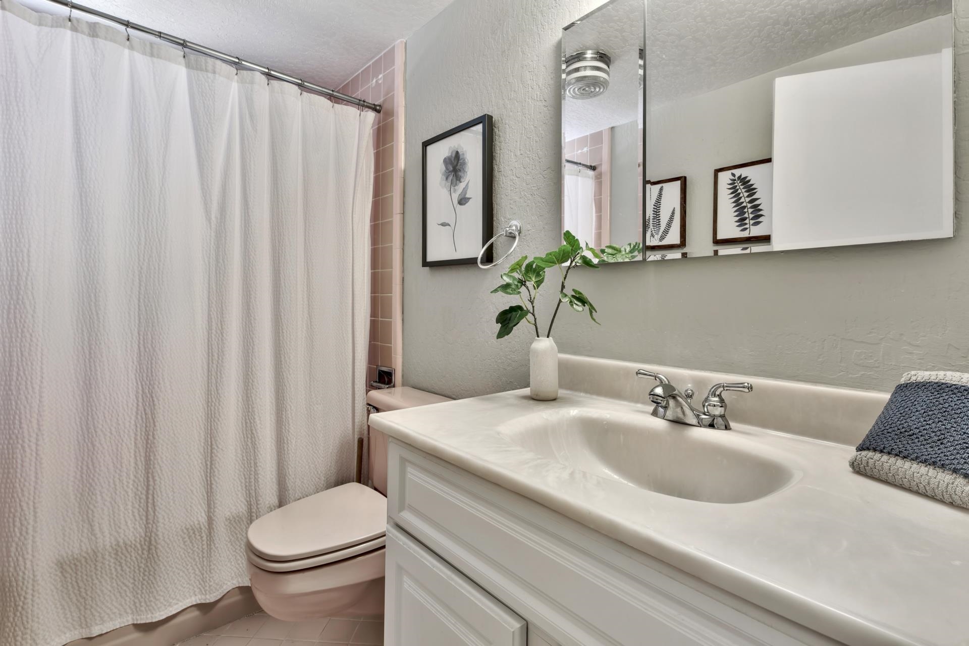 10101 Gregory Place Truckee, CA 96161 - Photo 19 of 21 a bathroom with a granite countertop sink and a mirror