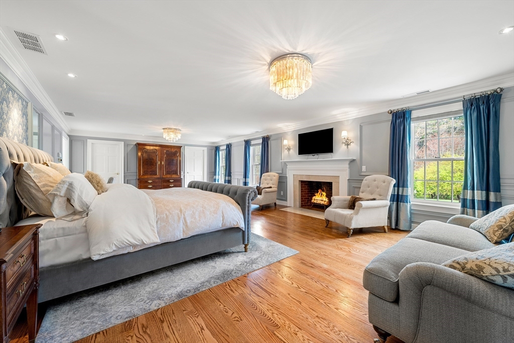219 A Ipswich Road Boxford, MA 01921 - Photo 19 of 41 a spacious bedroom with a bed and a fireplace