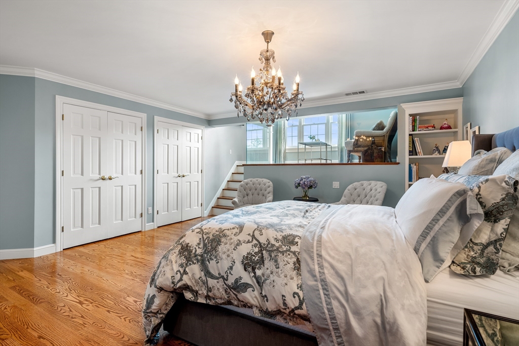 219 A Ipswich Road Boxford, MA 01921 - Photo 21 of 41 a bed sitting in a bedroom and chandelier