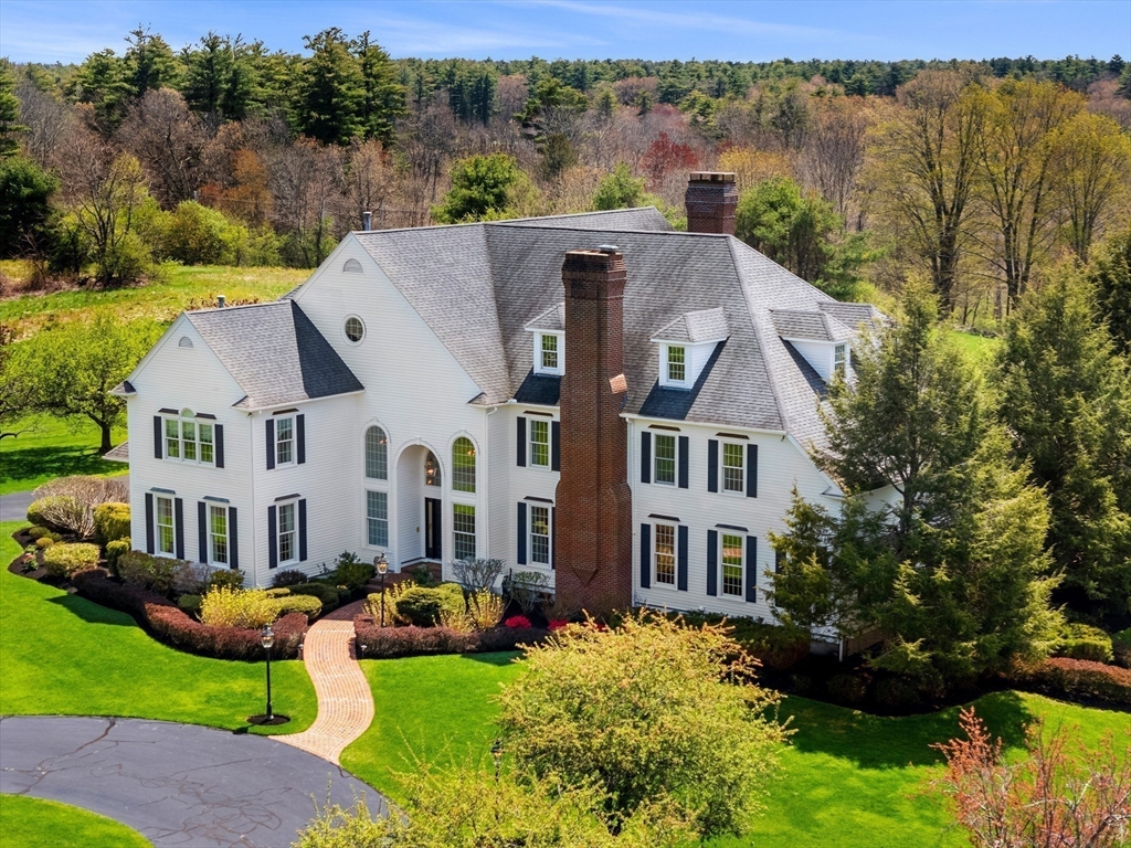 219 A Ipswich Road Boxford, MA 01921 - Photo 3 of 41 a aerial view of a brick house next to a yard with large trees
