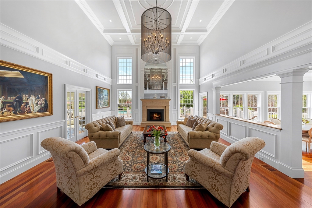 219 A Ipswich Road Boxford, MA 01921 - Photo 5 of 41 a living room with fireplace furniture and a large window
