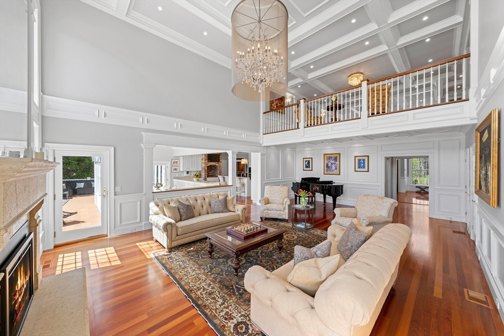 219 A Ipswich Road Boxford, MA 01921 - Photo 7 of 41 a living room with furniture and a chandelier