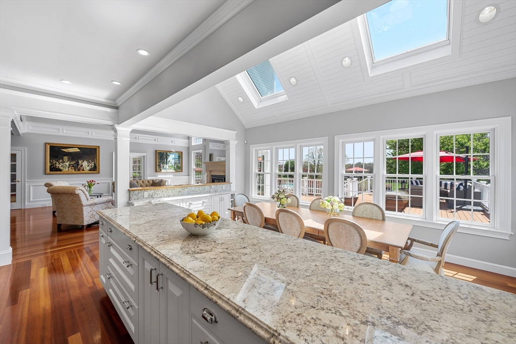 219 A Ipswich Road Boxford, MA 01921 - Photo 8 of 41 a kitchen with stainless steel appliances granite countertop sink stove and wooden floor