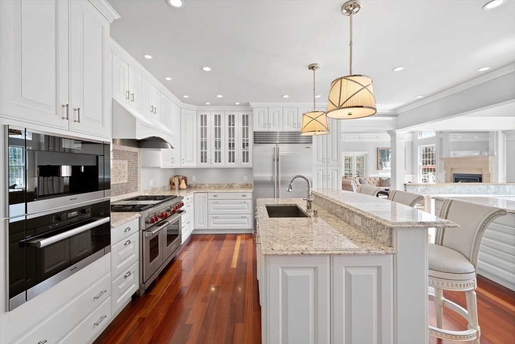 219 A Ipswich Road Boxford, MA 01921 - Photo 10 of 41 a kitchen with stainless steel appliances granite countertop a stove and cabinets