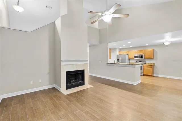 a view of kitchen with sink microwave and refrigerator