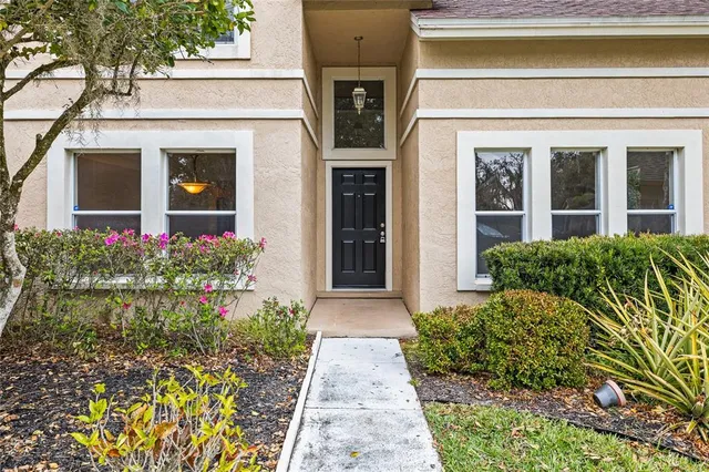 front view of a house with potted plants