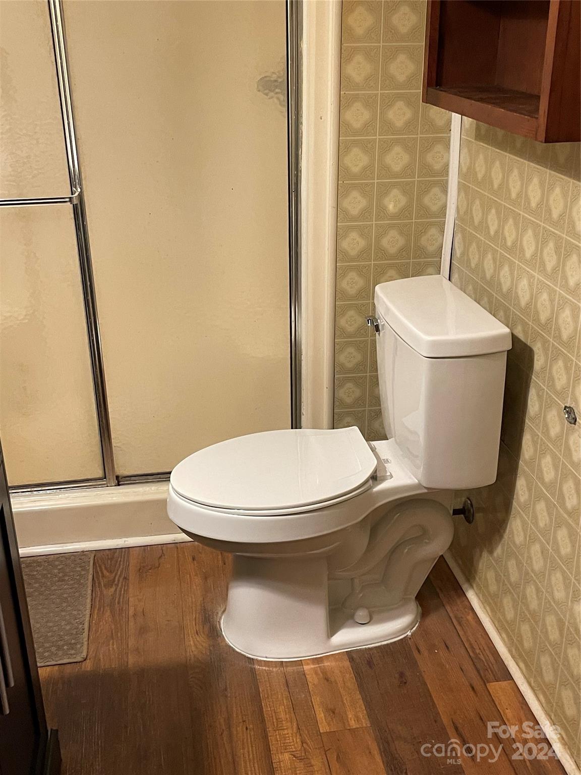 2508 Dora Drive Charlotte, NC 28215 - Photo 13 of 18 a white toilet sitting next to a white sink