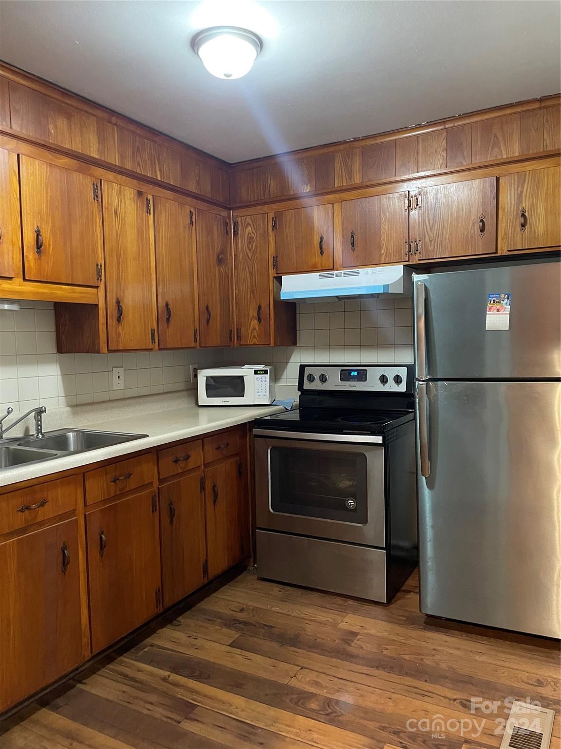 2508 Dora Drive Charlotte, NC 28215 - Photo 15 of 18 a kitchen with stainless steel appliances granite countertop a refrigerator a sink and a stove