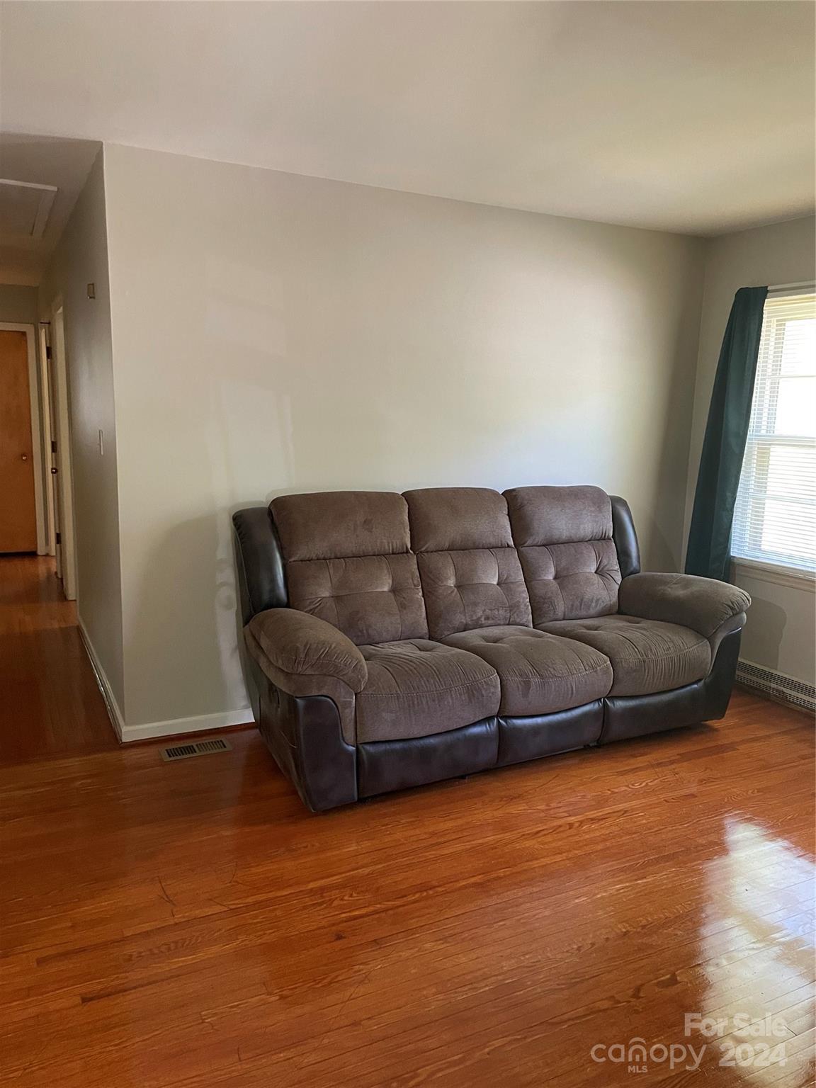 2508 Dora Drive Charlotte, NC 28215 - Photo 17 of 18 a living room with furniture and a flat screen tv
