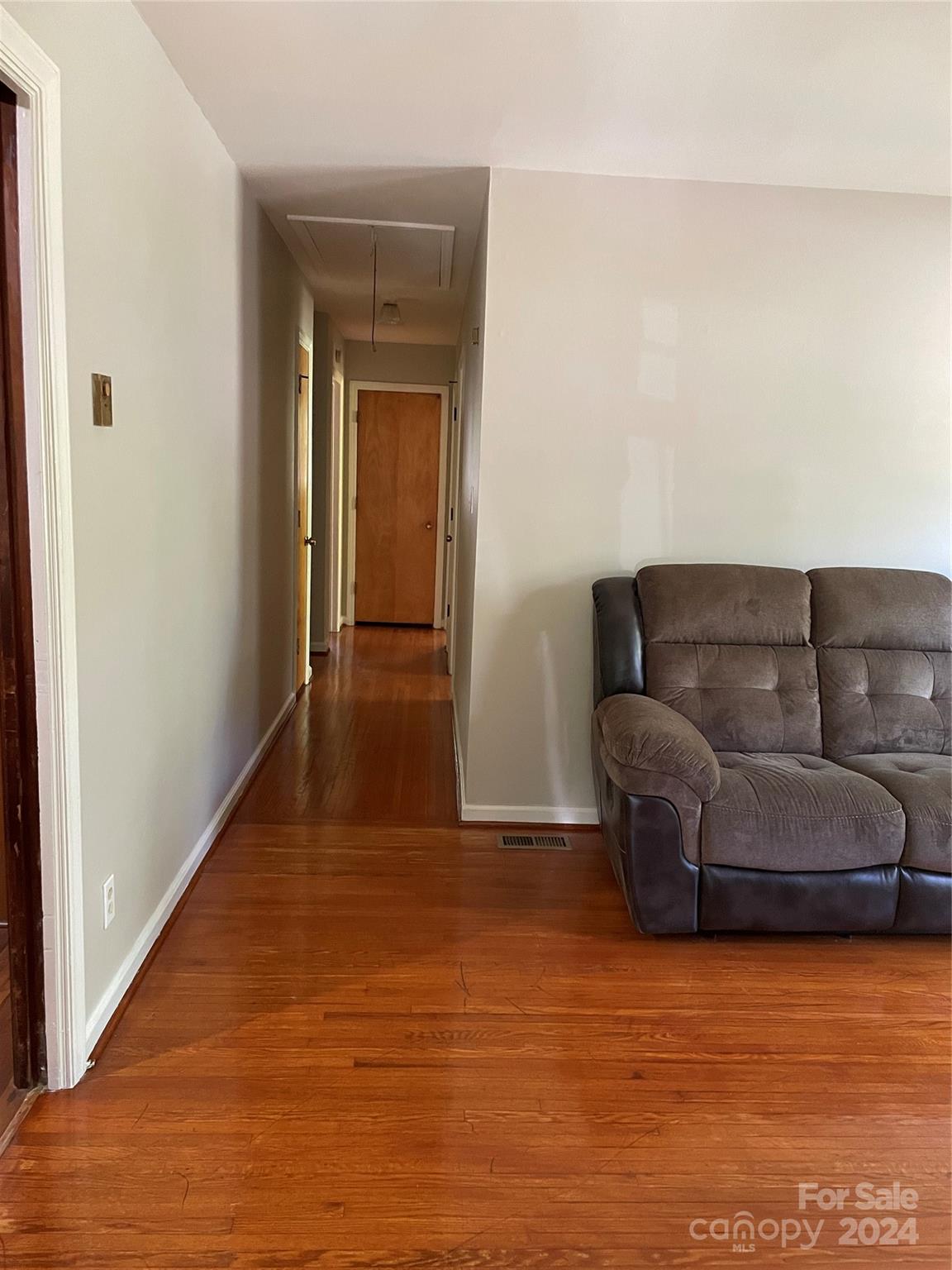 2508 Dora Drive Charlotte, NC 28215 - Photo 3 of 18 a living room with furniture and a wooden floor