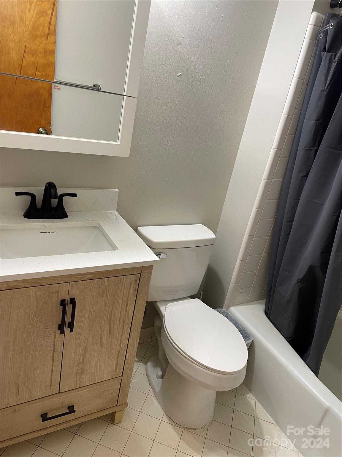 2508 Dora Drive Charlotte, NC 28215 - Photo 9 of 18 a white toilet sitting next to a sink